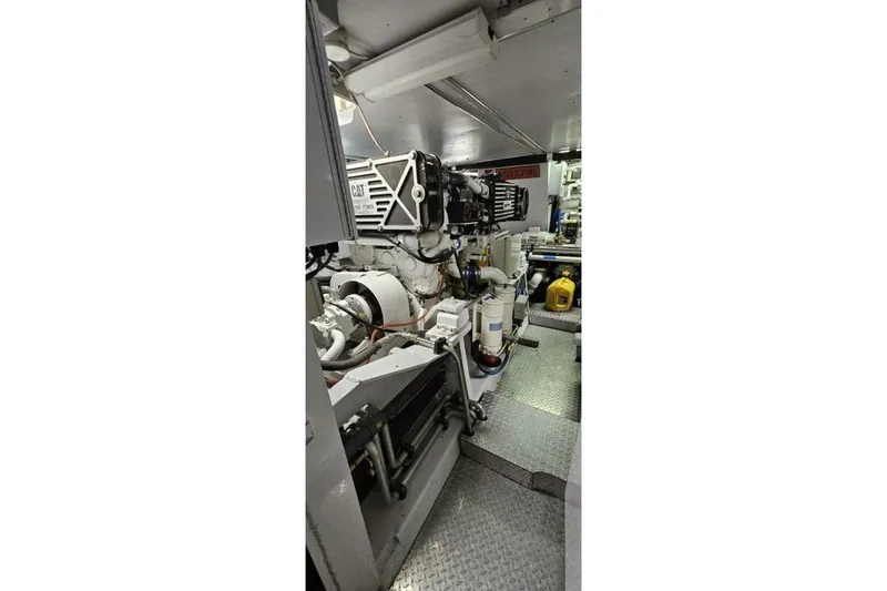 Slide: The Image of Engine room of 1969 Derecktor 68 Hunt Motor Yacht, featuring mechanical components and equipment. - 22