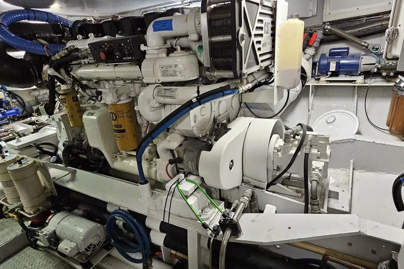 Slide: The Image of Engine room of 1969 Derecktor 68 Hunt Motor Yacht, showcasing mechanical components. - 24