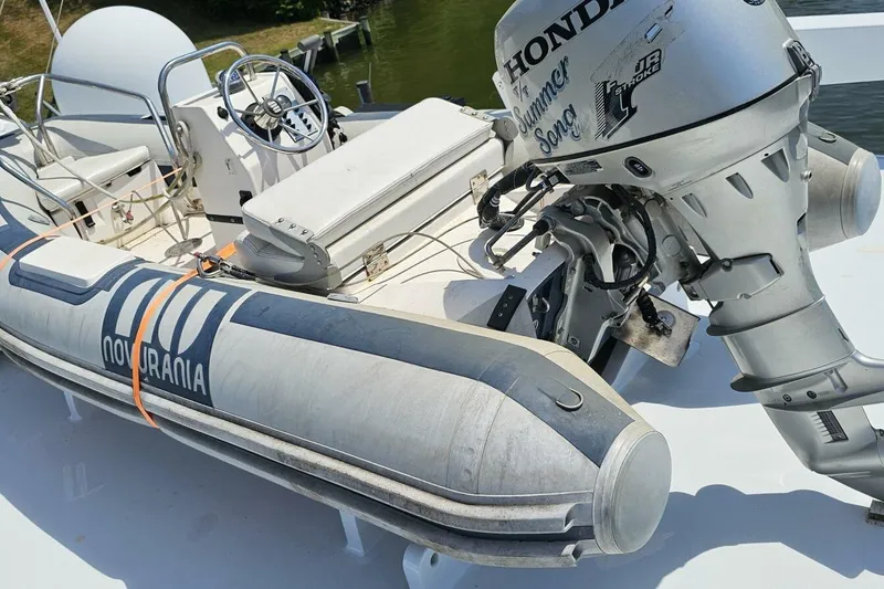 Slide: The Image of 1969 Derecktor 68 Hunt Motor Yacht with Novurania inflatable boat and Honda outboard motor. - 28