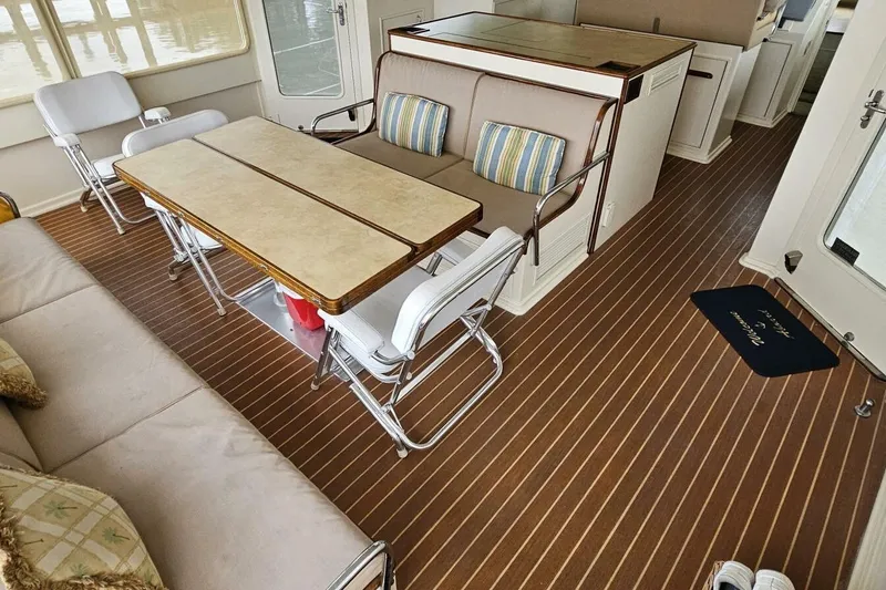 Slide: The Image of Interior of 1969 Derecktor 68 Hunt Motor Yacht with seating and dining area. - 6