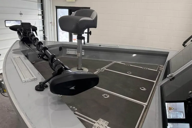 Slide: The Image of 2024 Hewescraft 221 Evolution boat interior with seating and storage compartments. - 19