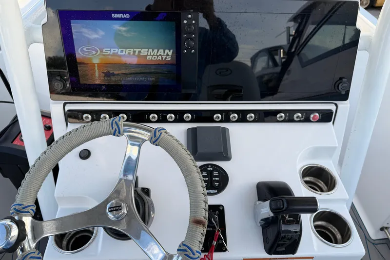 Slide: The Image of 2018 Sportsman Heritage 241 Center Console dashboard with steering wheel and Simrad display. - 12