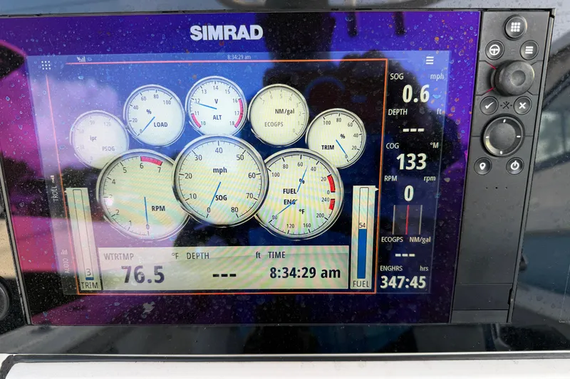 Slide: The Image of Simrad display on 2018 Sportsman Heritage 241 Center Console showing speed, RPM, and fuel data. - 15