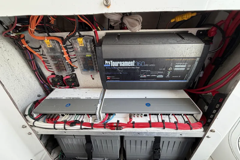 Slide: The Image of Electrical system of a 2018 Sportsman Heritage 241 Center Console boat, featuring ProTournament 360 charger. - 20