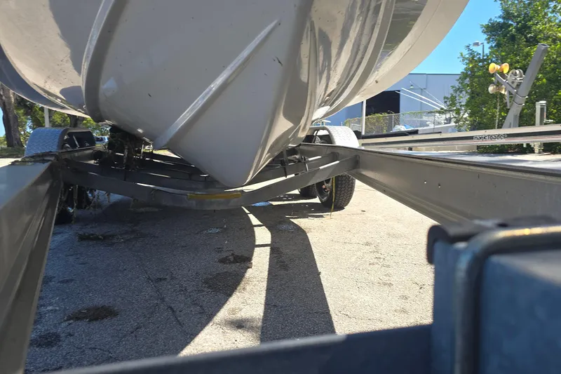 Slide: The Image of 2018 Sportsman Heritage 241 Center Console boat on trailer, viewed from below. - 21