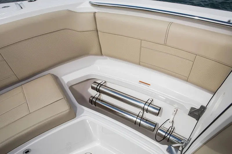 Slide: The Image of 2022 Pursuit S 328 Sport boat deck with dual engines and storage compartments. - 11