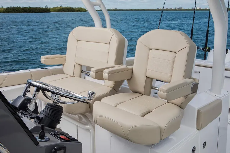 Slide: The Image of Manufacturer Provided Image: 2022 Pursuit S 328 Sport boat cruising on calm water. - 15