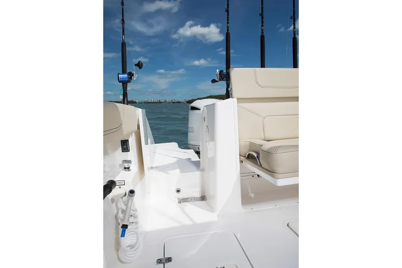 Slide: The Image of Manufacturer Provided Image: 2022 Pursuit S 328 Sport boat interior with seating and fishing rods. - 32