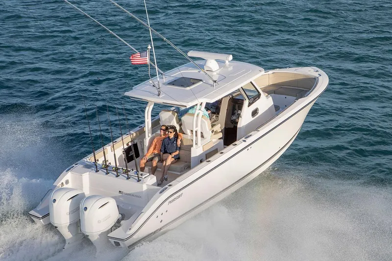 Slide: The Image of 2022 Pursuit S 328 Sport boat seats with quilted gray upholstery and adjustable armrests. - 5