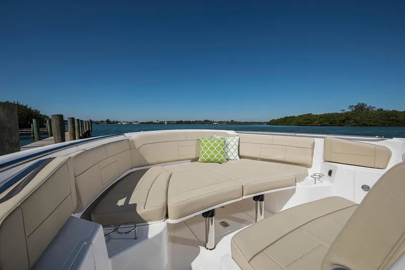 Slide: The Image of 2022 Pursuit S 328 Sport boat with Garmin radar, overcast sky background. - 7