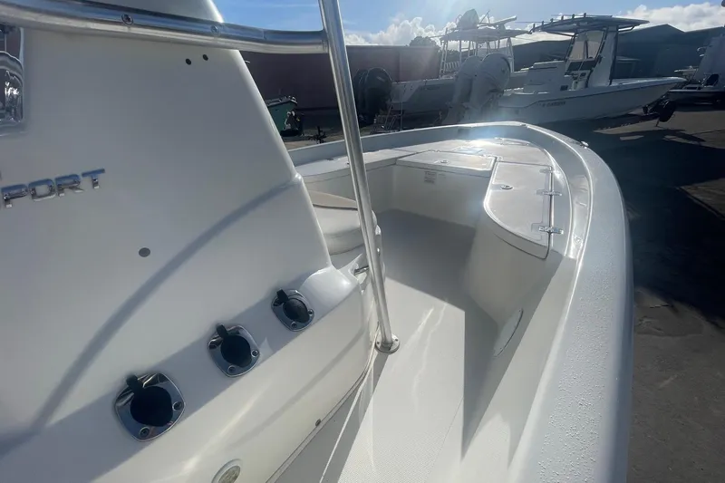 Slide: The Image of 2016 NauticStar 2110 Sport boat, white deck, docked under sunny skies. - 7