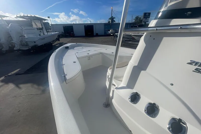 Slide: The Image of 2016 NauticStar 2110 Sport boat in a sunny marina setting. - 8