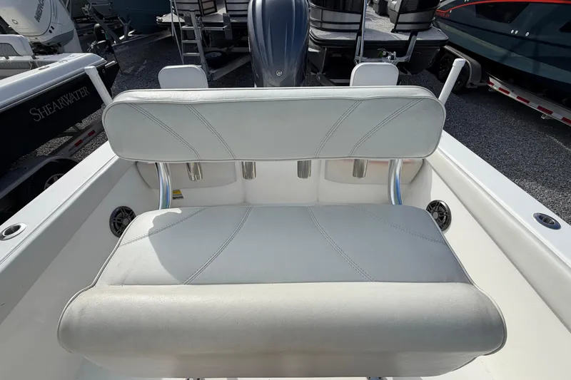 Slide: The Image of 2023 Contender 24 Sport boat seating with white upholstery and sleek design. - 11