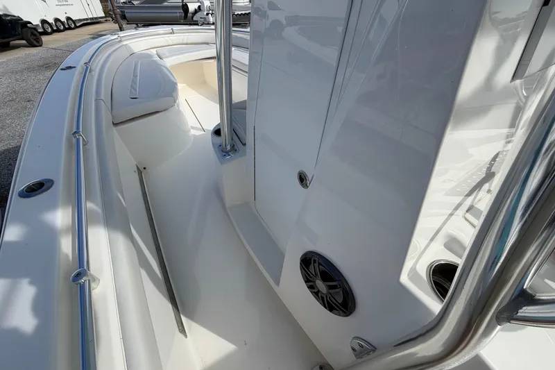Slide: The Image of 2023 Contender 24 Sport boat interior with sleek white design and stainless steel features. - 16