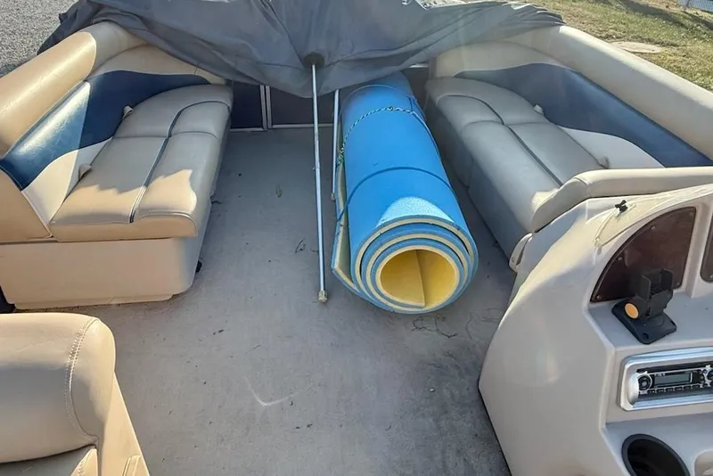 Slide: The Image of Interior of 2009 Sweetwater Tuscany Series 2086-23 boat with rolled blue mat. - 13