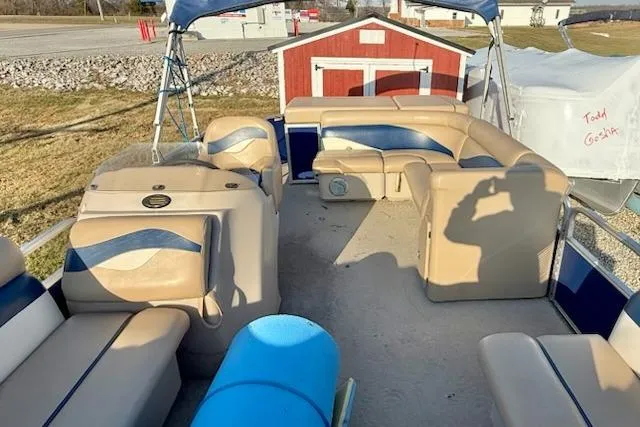 Slide: The Image of 2009 Sweetwater Tuscany Series 2086-23 pontoon boat with beige seating and blue accents. - 14