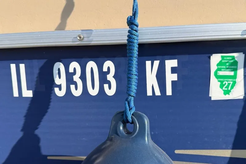 Slide: The Image of 2009 Sweetwater Tuscany Series boat with registration IL 9303 KF and Illinois watercraft sticker. - 3