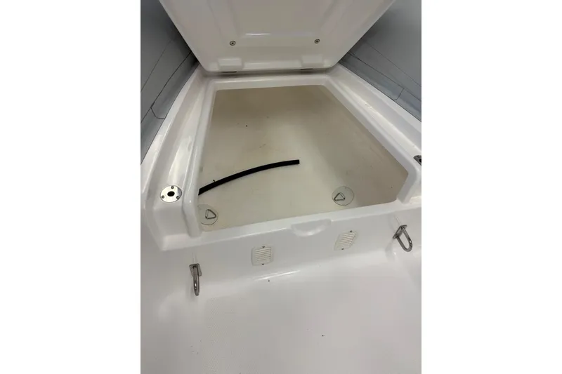 Slide: The Image of Open storage compartment of 2024 Flexboat F-12, showcasing interior space. - 6