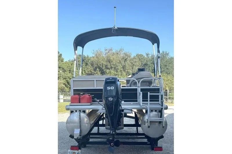 Slide: The Image of 2022 Sun Tracker Bass Buggy 16 XL pontoon boat with canopy and outboard motor. - 3