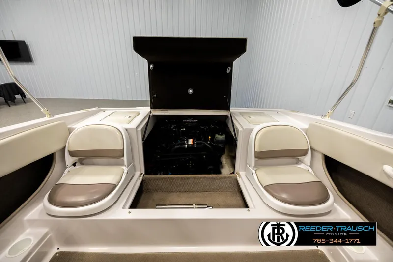 Slide: The Image of 2003 Four Winns 180 Freedom I/O boat interior with open engine compartment. - 19