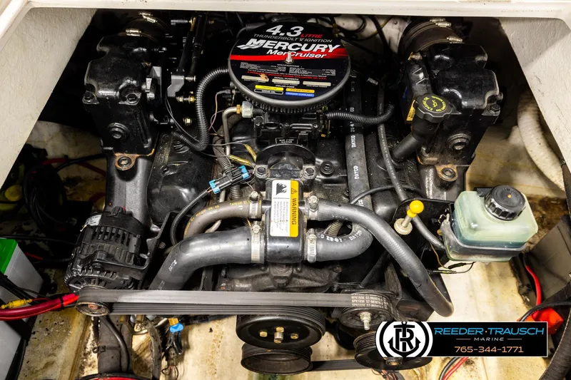 Slide: The Image of 2003 Four Winns 180 Freedom I/O engine compartment with Mercury MerCruiser 4.3L engine. - 20