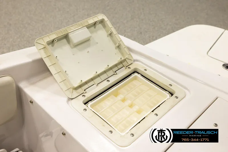 Slide: The Image of Open storage compartment on 2003 Four Winns 180 Freedom I/O boat. - 23