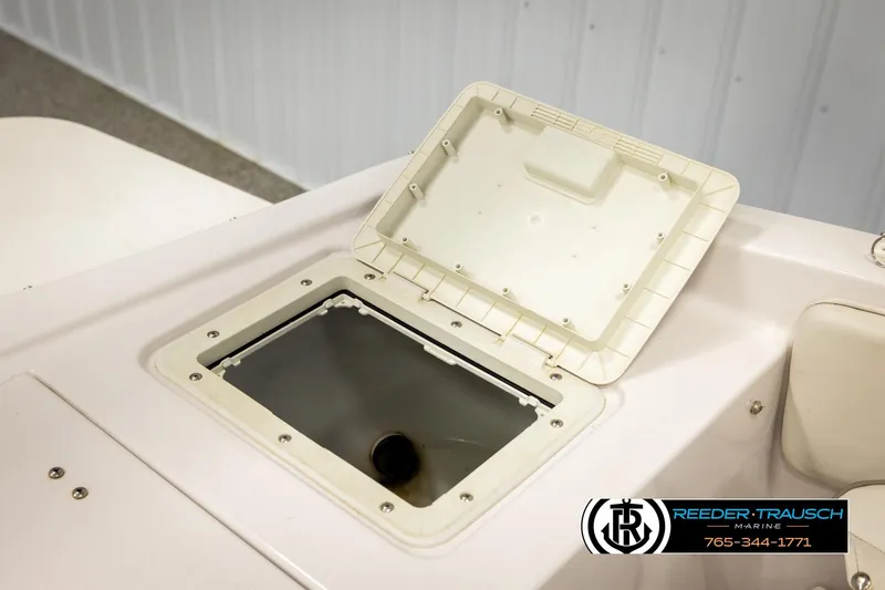 Slide: The Image of Open storage compartment on 2003 Four Winns 180 Freedom I/O boat deck. - 25