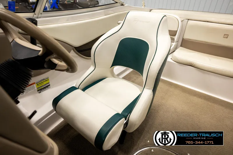 Slide: The Image of Interior of 2003 Four Winns 180 Freedom I/O boat with white and green seating. - 27