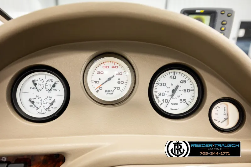 Slide: The Image of Dashboard of 2003 Four Winns 180 Freedom I/O boat with gauges and controls. - 32