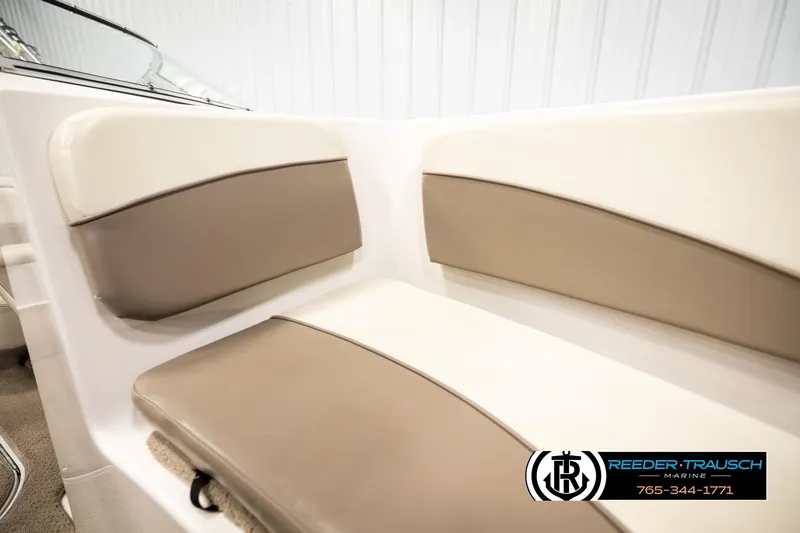 Slide: The Image of 2003 Four Winns 180 Freedom I/O boat interior seating, beige and brown upholstery. - 37