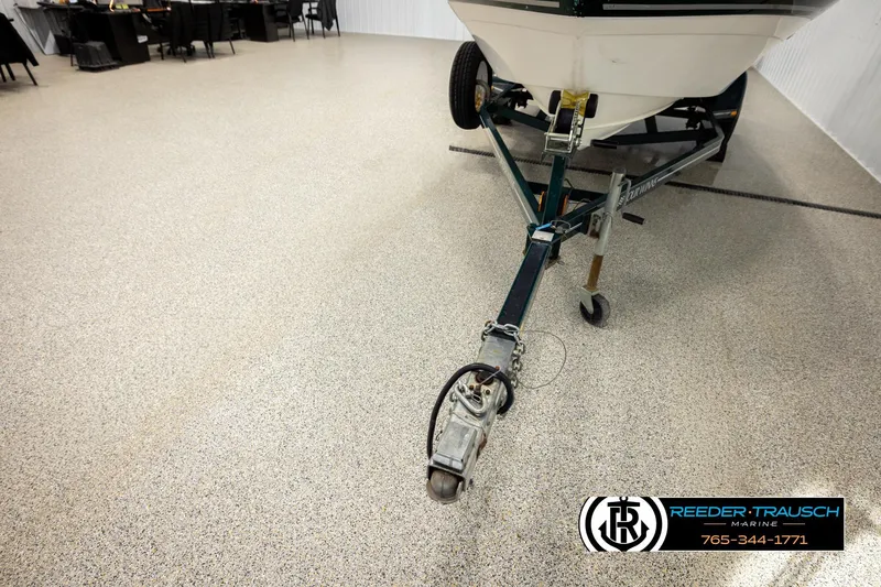 Slide: The Image of 2003 Four Winns 180 Freedom I/O boat on trailer in showroom. - 47