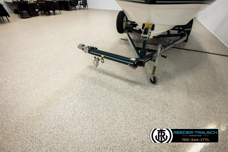 Slide: The Image of 2003 Four Winns 180 Freedom I/O boat on trailer in showroom. - 48