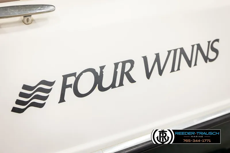 Slide: The Image of 2003 Four Winns 180 Freedom I/O boat logo with Reeder-Trausch Marine branding. - 50