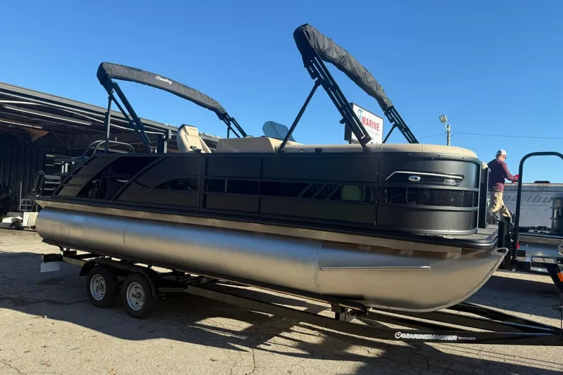 Slide: The Image of 2026 Bentley Pontoons Elite 223 Swingback Bench on trailer. - 2