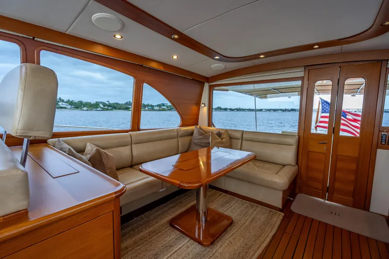 Slide: The Image of Luxurious interior of 2018 Palm Beach Motor Yachts PB55 with elegant wood finish and waterfront view. - 18