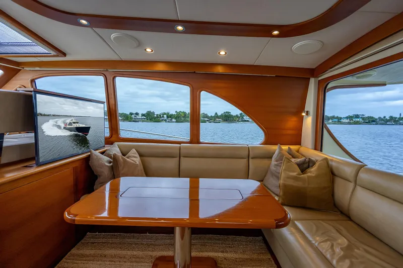 Slide: The Image of Luxurious interior of 2018 Palm Beach Motor Yachts PB55 with elegant wood finish and waterfront view. - 20