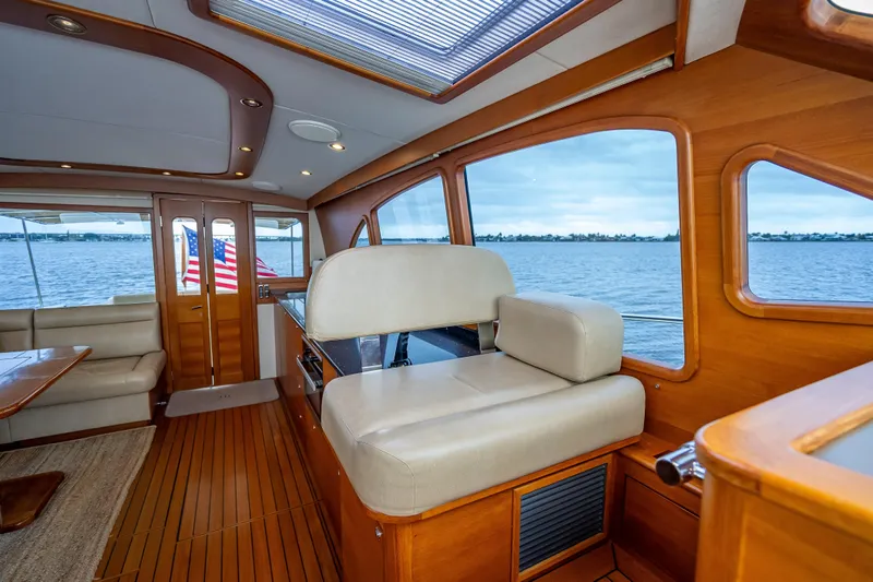 Slide: The Image of Luxurious interior of 2018 Palm Beach Motor Yachts PB55 with elegant wood finish and waterfront view. - 26