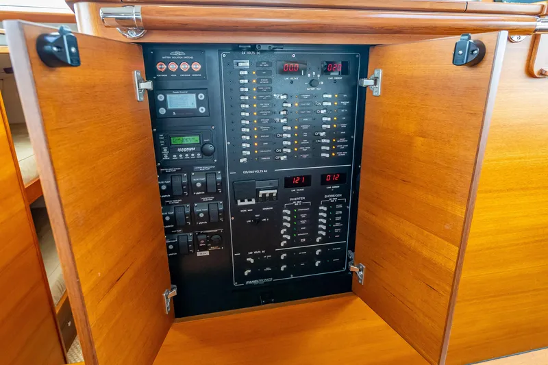 Slide: The Image of Electrical control panel inside 2018 Palm Beach Motor Yachts PB55, featuring various switches and displays. - 33
