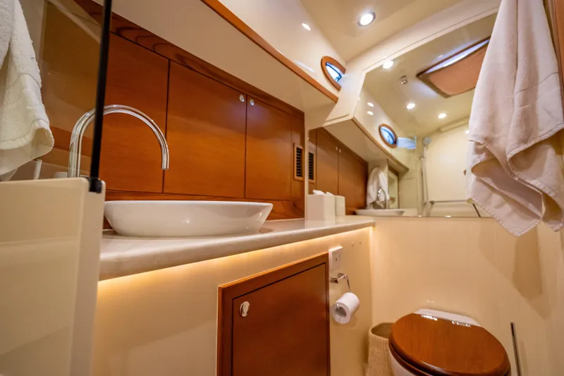 Slide: The Image of Luxurious bathroom interior of 2018 Palm Beach Motor Yachts PB55, featuring elegant wood finishes. - 49