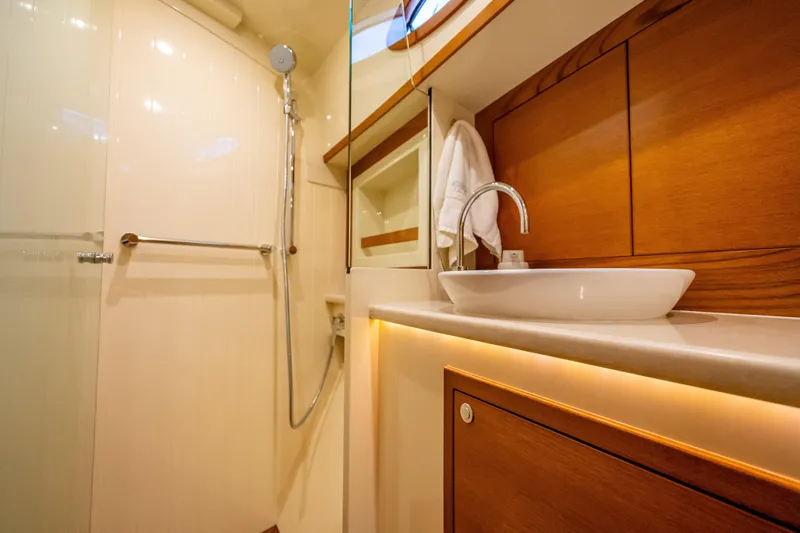 Slide: The Image of Luxurious bathroom interior of 2018 Palm Beach Motor Yachts PB55, featuring elegant wood finishes. - 50