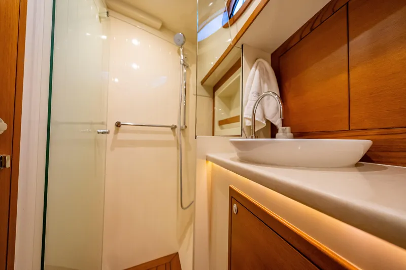 Slide: The Image of Luxurious bathroom in 2018 Palm Beach Motor Yachts PB55, featuring modern sink and shower. - 51