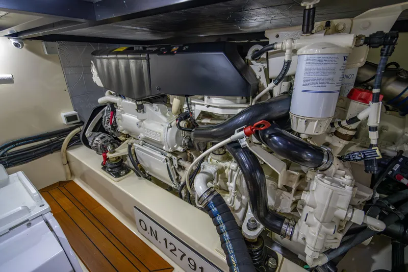Slide: The Image of Engine room of 2018 Palm Beach Motor Yachts PB55, showcasing detailed mechanical components. - 58