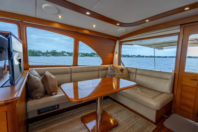 Slide: The Image of Luxurious interior of 2018 Palm Beach Motor Yachts PB55 with elegant seating and scenic water view. - 19
