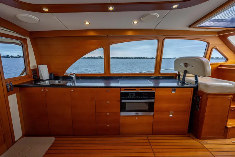Slide: The Image of Luxurious 2018 Palm Beach Motor Yachts PB55 interior with sleek kitchen and panoramic windows. - 25