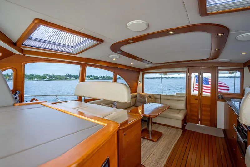 Slide: The Image of Luxurious interior of 2018 Palm Beach Motor Yachts PB55 with elegant wood finishes and waterfront view. - 27