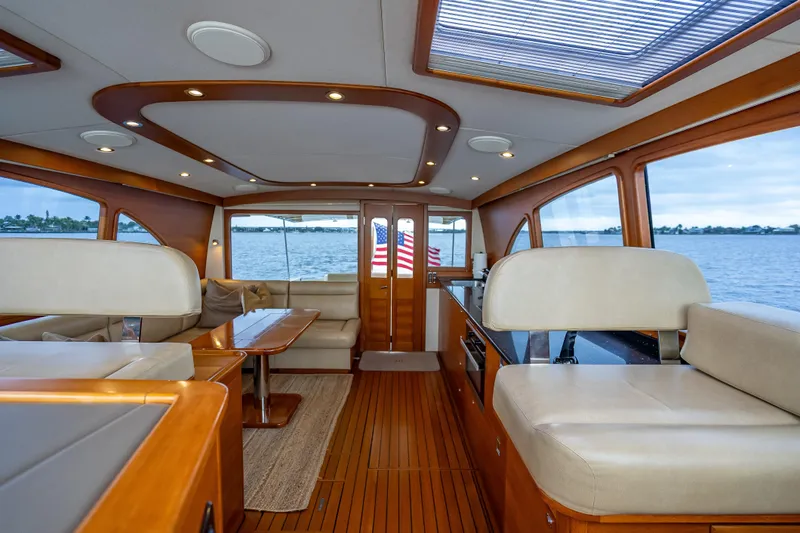 Slide: The Image of Luxurious interior of 2018 Palm Beach Motor Yachts PB55 with elegant wood finishes and seating. - 28