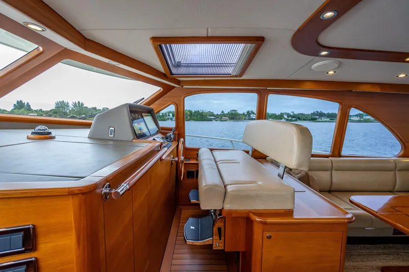 Slide: The Image of Luxurious interior of 2018 Palm Beach Motor Yachts PB55, featuring elegant wood and leather finishes. - 29