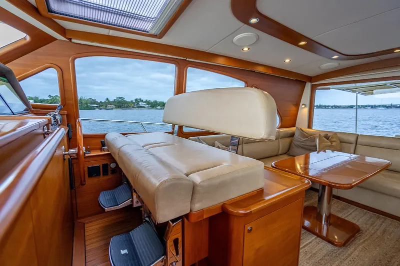 Slide: The Image of Luxurious interior of 2018 Palm Beach Motor Yachts PB55 with elegant seating and wood finishes. - 30
