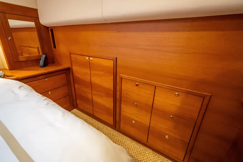 Slide: The Image of Luxurious wooden cabinetry in 2018 Palm Beach Motor Yachts PB55 interior bedroom. - 37