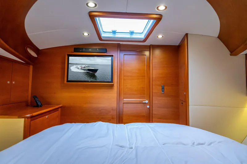 Slide: The Image of Luxurious 2018 Palm Beach Motor Yachts PB55 cabin interior with wood finish and skylight. - 45